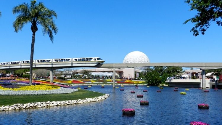 epcot flower and garden festival with Spaceship Earth and monorail in the background at walt disney world