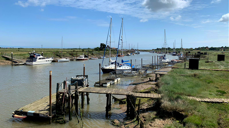 boats at morston quay, north norfolk coast, england