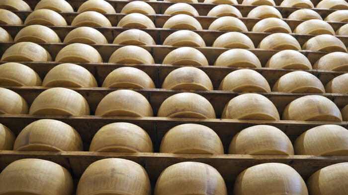 Hundreds of wheels of Parmigiano-Reggiano being aged.