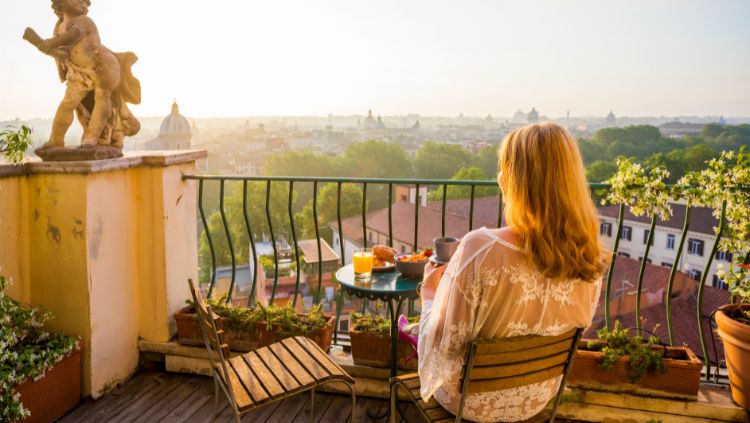 image, woman on balcony, slow travel