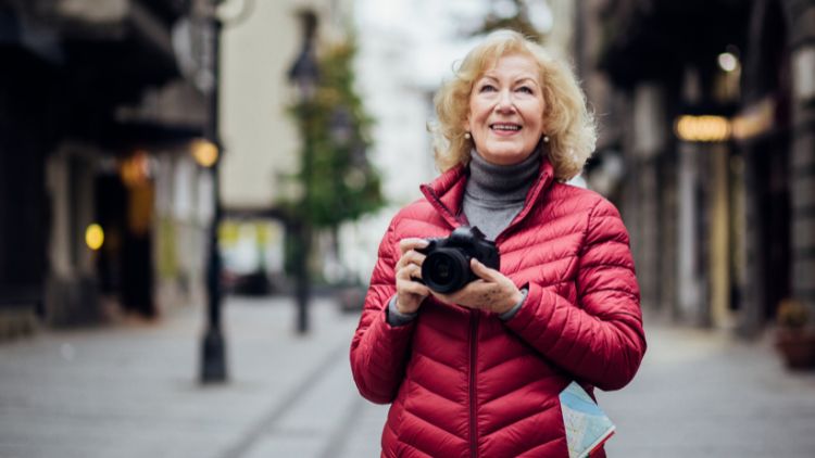 woman with camera in street